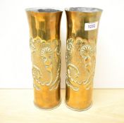 A pair of French World War I brass 75DEC Trench Art shell cases, having flared rims over well