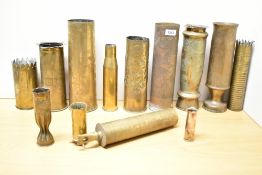 A group of twelve World War I & II brass Trench Art shell cases, various sizes, to include a