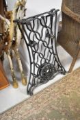 A pair of cast iron Singer sewing machine bench ends
