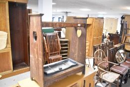 An Art Nouveau hall stand, in need of restoration, having heart motif to ends, width approx. 61cm
