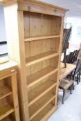 A tall pine bookcase, approx. H198 W95cm