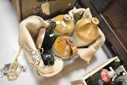 Three stoneware flagons , three glass bottles and copper bottomed dish , and small quantity of