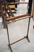 An Edwardian mahogany towel rail