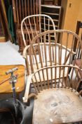 A pair of stripped windsor style hoop and stick back carver chaira