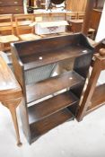 An early 20th Century oak open bookshelf of small proportions, width approx. 58cm