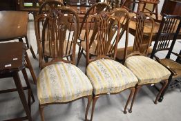 A set of three early 20th Century mahogany salon chairs having overstuffed seats