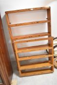 Two stained delft racks of narrow proportions
