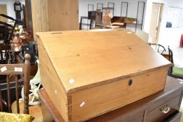 A 19th Century natural pine clerks desk, having internal drawers, width approx. 76cm