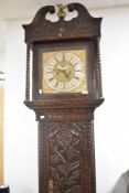 An 18th Century oak long cased clock having eight day movement with brass and silvered dial named