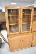 An Ercol Windsor glazed display cabinet, height approx. 183cm, width 91cm