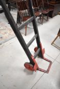 A vintage wooden sack bogey , with cast wheels and supports, possibly Railway related