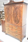 A 19th Century mahogany Regency design linen press having two over two drawer base on bracket