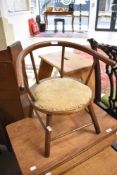 A childs bentwood arm chair