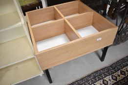 A compartmental play or similar table, approx. 62 x 62cm, height 43cm