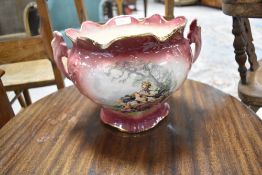 A reproduction Victorian style two handled jardiniere having cerise ground transfer decoration
