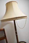 A traditional standard lamp having turned column and base