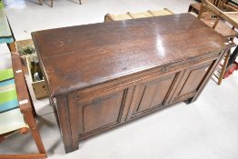 A period oak kist having triple panel, dimensions approx. W131 D52 H69cm