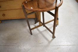 An early 20th Century oak 'Revertable' card/tea table, diameter approx. 61cm