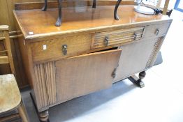 An early 20th Century oak sideboard, width approx. 135cm