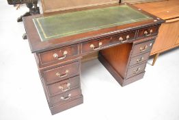 A reproduction mahogany and skiver top pedestal desk, width approx. 122cm