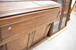 A 19th Century mahogany secretaire bookcase having glazed top and cupboard under fitted desk