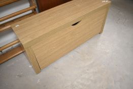 A beech effect laminate shoe bench having drop front, width approx. 100cm