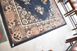 A modern Chinese style carpet square having blue ground , with foliate pattern, approx. 273 x 186cm