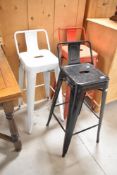 Three metal bar stools, red white and black
