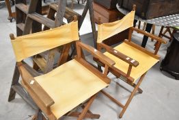 Two directors style garden chairs