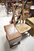An Old Charm style occasional table having drop leaves and a 19th Century rush seated ladder back