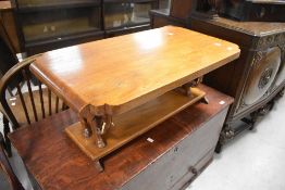 An Oriental style coffee table having elephant supports (with camel bone tusks), width approx. 92cm