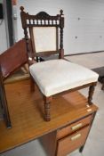 A Victorian mahogany nursing chair having upholstered back and seat
