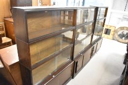 Three early 20th Century four tier stacking bookcases