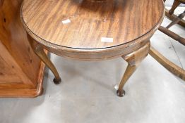 An early 20th Century mahogany coffee table having circular top and cabriole legs, diameter