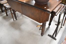 An interesting Victorian Pembroke style table having wind out mechanism with two additional