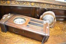 An early to mid 20th Century mahogany cased wall clock and a similar mantel clock case (movement