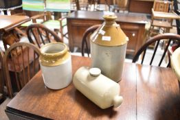 A stoneware flagon, hot water bottle and jar