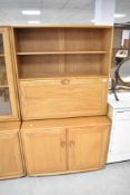 An Ercol Windsor bureau bookshelf, height approx. 183cm, width 91cm