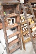 Three sets of vintage step ladders