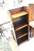An early 20th Century oak narrow shelf, labelled on reverse for 'Homettes' , dimensions approx.