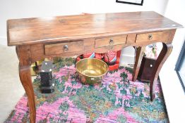 A modern hardwood console table having triple frieze drawers and shaped legs, width approx. 140cm,