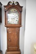 A 19th Century oak and mahogany longcase clock having eight day movement and painted dial, with