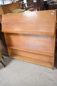 A vintage beech three tier picture display stand, width approx. 122cm