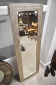 A modern full length wall mirror, having silvered pattern, approx. 132 x 46cm