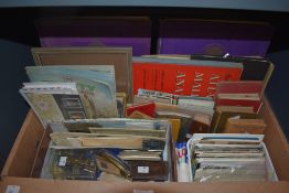 A selection of vintage ephemera including postcards, stamp albums, first day covers, photographs