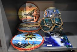 Three hand painted flat headed drums, two glass buoys, a water themed display plate and three