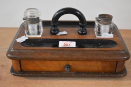 A Victorian ink stand with drawer and ink bottles. One bottle AF and handle slightly loose.