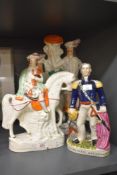A Staffordshire style figures including a musician on horseback, Robin Hood and General Napier.