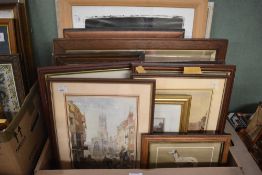 A carton of assorted pictures and prints many of which are buildings.