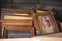 A carton of assorted picture frames.